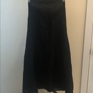 Black textured strapless dress.